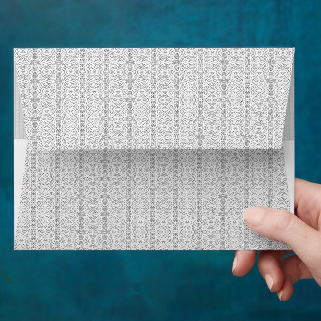 a white and gray wallpaper with a pattern on it envelope (Hand)