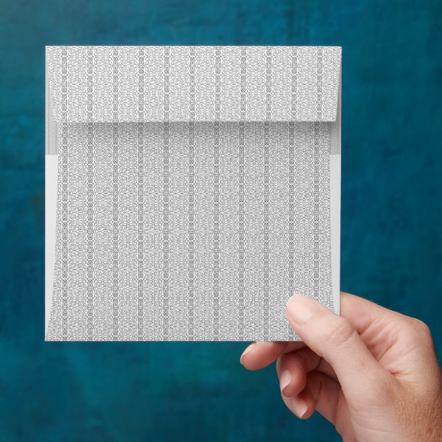 a white and gray wallpaper with a pattern on it envelope (Hand)