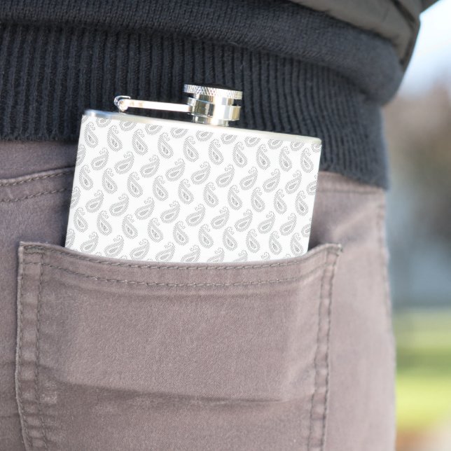 a white background with a pattern in the middle flask (In Situ)
