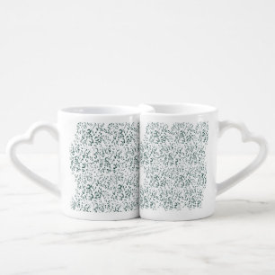 a white background with lots of drops of water coffee mug set