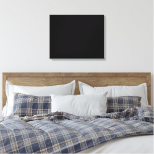 A white clock displayed prominently against a soli canvas print