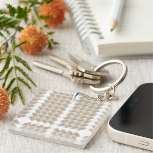 A white, equilateral triangle centered on a plain keychain