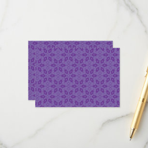 A white wrapping paper with a repeating pattern of enclosure card