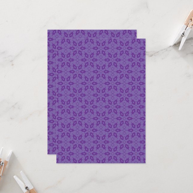 A white wrapping paper with a repeating pattern of invitation (Front/Back In Situ)