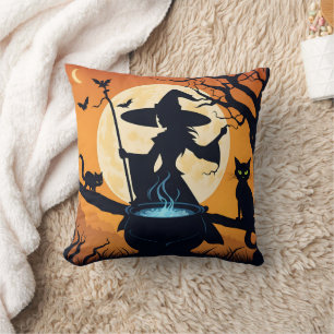 A witch brewing potions under a full moon throw pillow