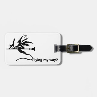 A witch on a broomstick with a cat luggage tag