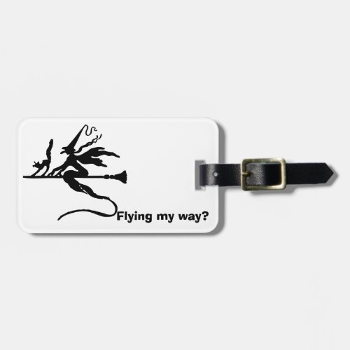 A witch on a broomstick with a cat luggage tag