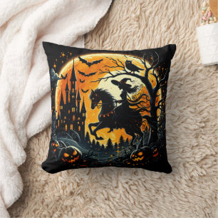 A witch rides under a spooky harvest moon throw pillow