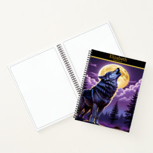 A wolf howling at the full moon on a sketchbook notebook