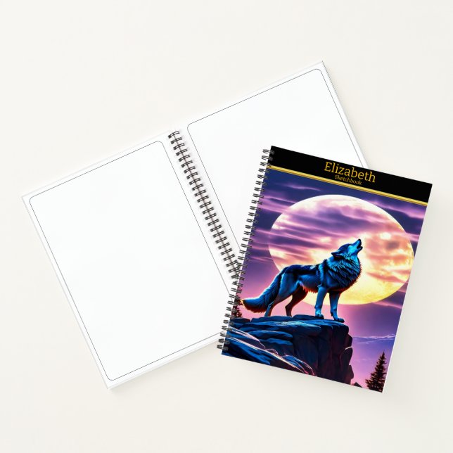 A wolf howls at a full moon on a sketchbook notebook (Inside)