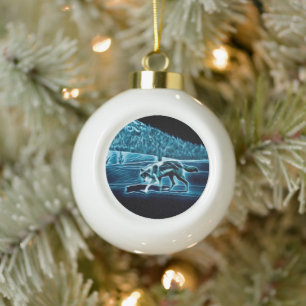 A Wolf On Snow Ceramic Ball Christmas Ornament