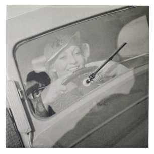 A woman driving, c.1930s (photogravure) ceramic tile