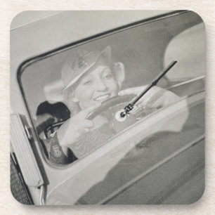 A woman driving, c.1930s (photogravure) drink coaster