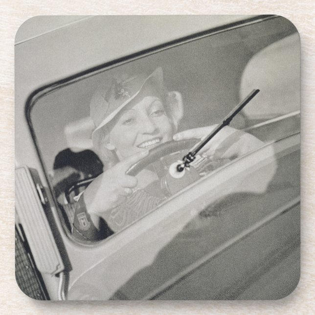 A woman driving, c.1930s (photogravure) drink coaster (Front)