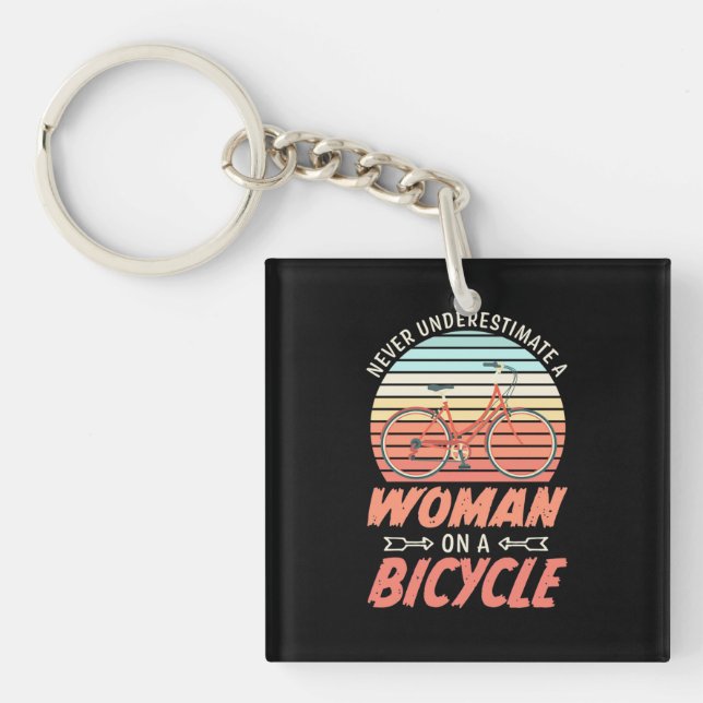 A Woman On A Bicycle Keychain (Front)