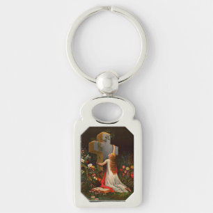 A woman with a cross is praying keychain