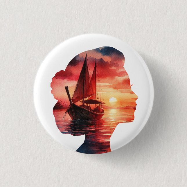 a woman's head enveloping a sunset with a sailboat button (Front)