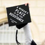 A Woman's Place Is In The Resistance Graduation Cap Topper<br><div class="desc">Feminist grad cap topper features the quote "a woman's place is in the resistance" in white collegiate lettering on a black background. Personalize with your class year and/or school name.</div>