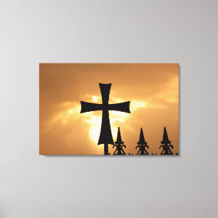 A Wrought-iron Cross on a Fence Canvas Print