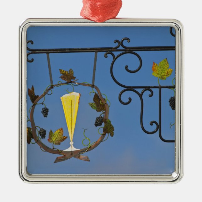 A wrought iron sign that illustrates the theme metal ornament (Front)