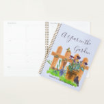 A Year in the Garden Gardener's Planner<br><div class="desc">Personalized gardening planner with any start date. The cover is light blue with elegant hand lettered script typography which reads "A Year in the Garden" with a gorgeous watercolor illustration of a country cottage garden. It features a picket fence and plant pot of pansy flowers, a grass lawn, blackbird, butterfly...</div>