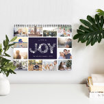 A Year of Joy | Photo Calendar<br><div class="desc">Share a favorite memory on each page of this 2019 photo calendar, with photos framed with a botanical leaves pattern in seasonal colors. Cover features a thumbnail version of each photo with "a year of joy" in the center in white letters formed by holiday botanicals and berries. Personalize the cover...</div>