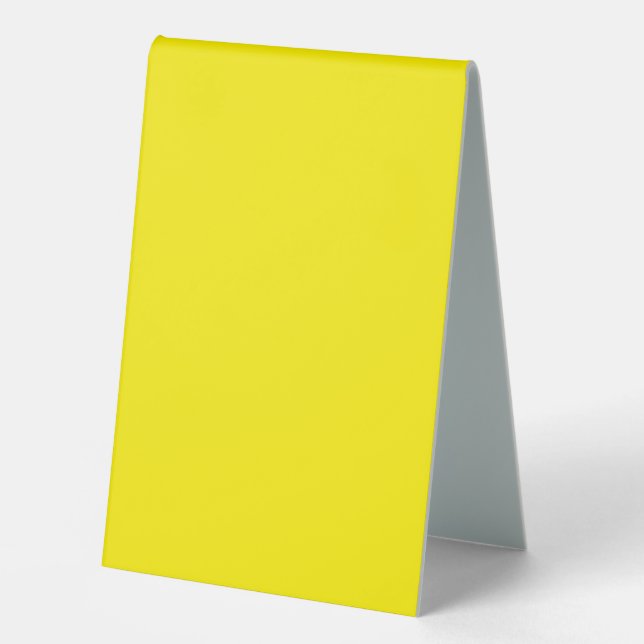 a yellow background with a black border table tent (Front)