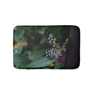A Yellow Butterfly on Pink Flowers Bath Mat