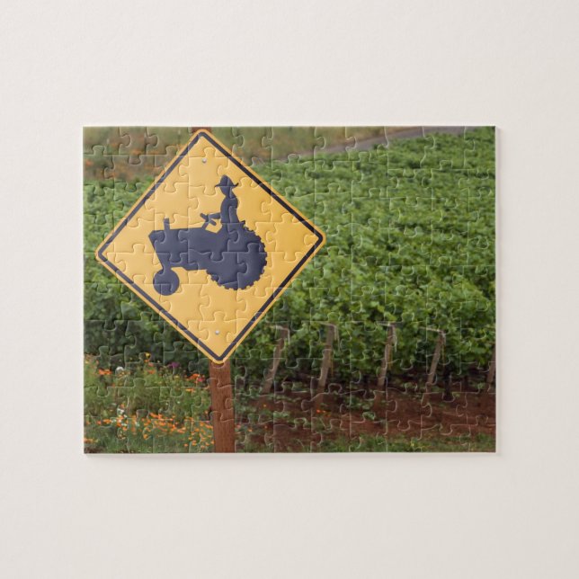A yellow tractor crossing sign in the vineyard jigsaw puzzle (Horizontal)