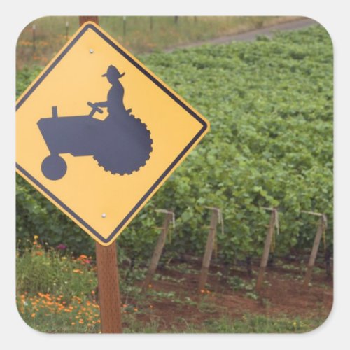 A yellow tractor crossing sign in the vineyard square sticker