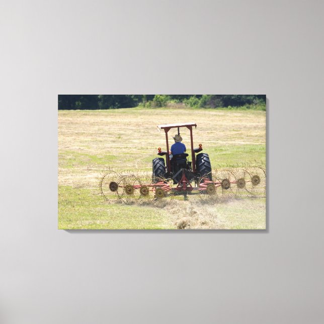 A young boy driving a tractor harvesting canvas print (Front)