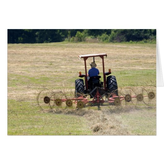 A young boy driving a tractor harvesting cards (Front Horizontal)