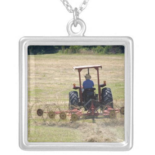 A young boy driving a tractor harvesting silver plated necklace
