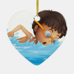 A Young Boy Swimming With A Yellow Goggles Ceramic Ornament at Zazzle