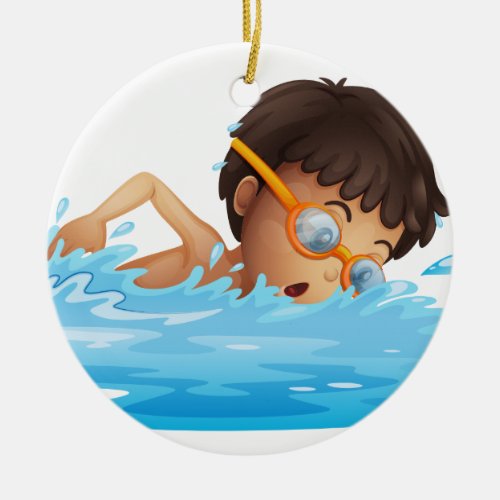 A young boy swimming with a yellow goggles ceramic ornament