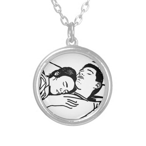 A young couple sleeps sweetly hugging each other silver plated necklace