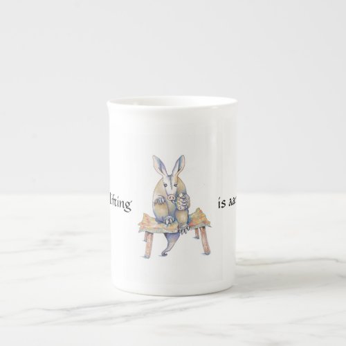 Aardvark cartoon sitting and drinking from a mug
