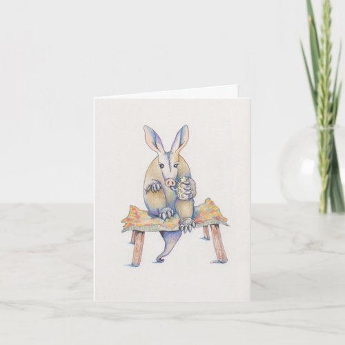 Aardvark sitting on stool enjoying a drink card