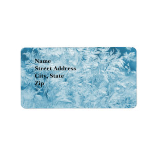 abstract blue feathers and snowflakes label