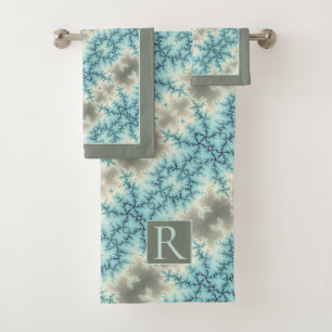 Abstract blue, gray snowflake pattern and monogram bath towel set