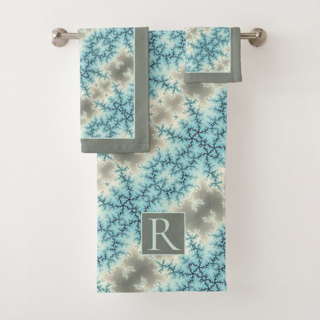 Abstract blue, gray snowflake pattern and monogram bath towel set (Insitu)