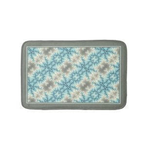 Abstract blue, gray snowflake pattern with border bath mat