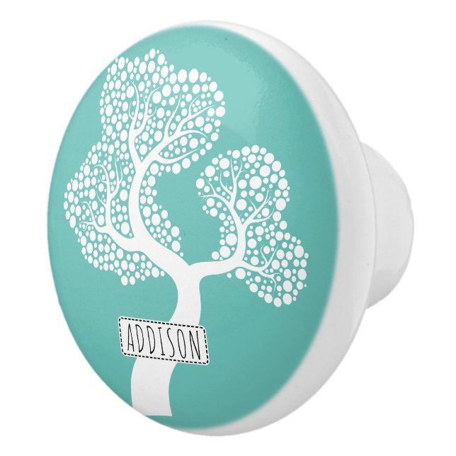 Abstract circle tree and name on light teal ceramic knob (Right)