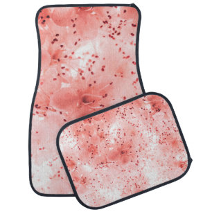 Abstract floral backdrop of pink flowers over past car floor mat