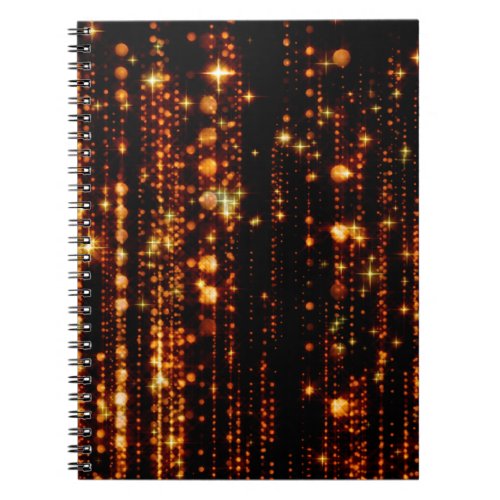 Abstract gold rain with bright particles with flar notebook