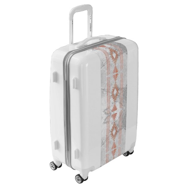 rose gold and white suitcase