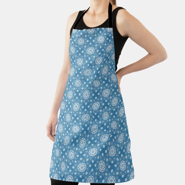 Abstract openwork floral pattern in light blue col apron (Insitu)