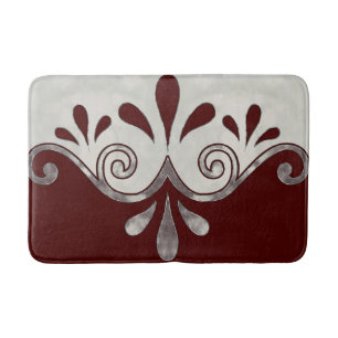 Abstract ornamental shape in burgundy and silver bath mat