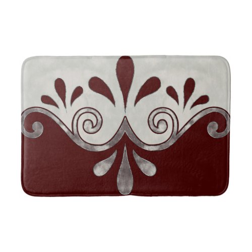 Abstract ornamental shape in burgundy and silver bath mat