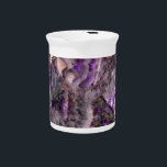 Abstract purple Amethyst Quartz, purple granite Drink Pitcher<br><div class="desc">A mesmerizing dance of rich purples swirl and twirl, intermingling in a symphony of elegance and sophistication. Like wisps of smoke frozen in time, delicate veins of lavender, violet, and royal plum traverse the surface, creating an intricate labyrinth of beauty. Each curve and contour tells a unique story, inviting the...</div>